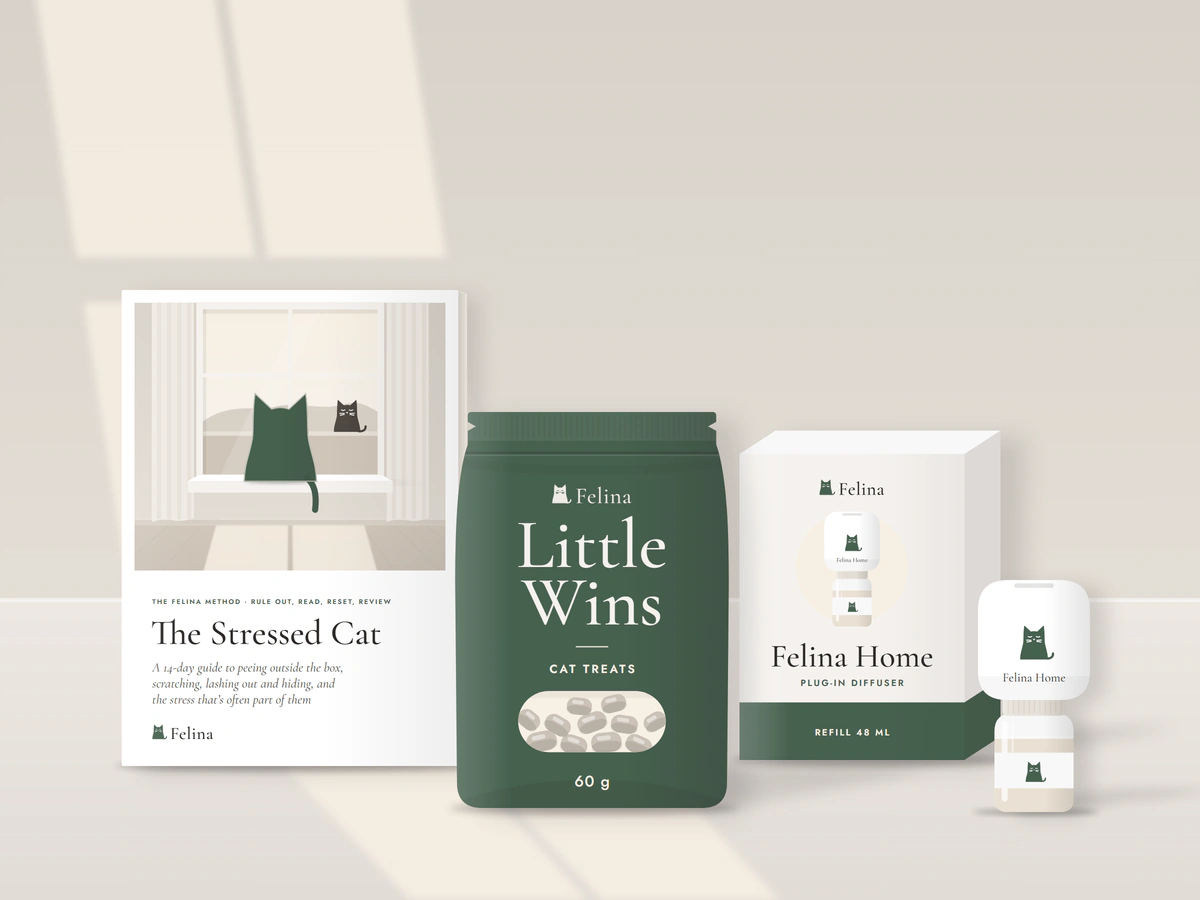 Illustration: The Stressed Cat booklet, a bag of Little Wins, the Felina Home box and the diffuser with its refill, side by side